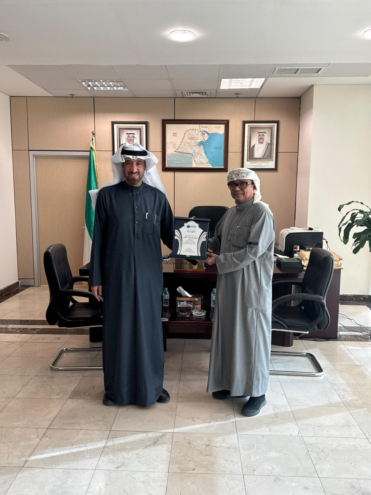 Dr. Noor Mohammed Badie in a formal diplomatic meeting.